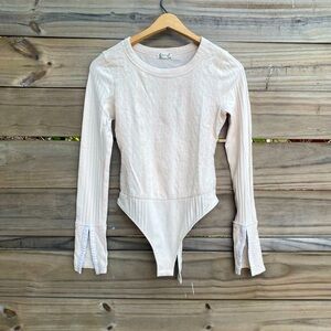 Free People Cream Bodysuit with Elegant Design